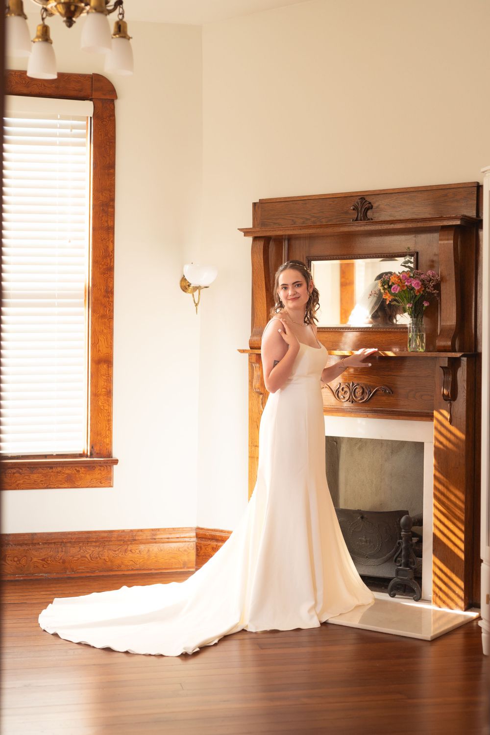 Elegant bridal preparation room with wooden trim and natural lighting.