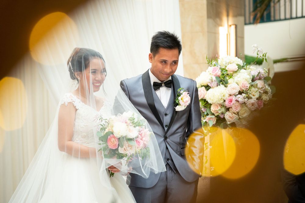 Wedding photography with warm golden lighting and elegant floral arrangements.
