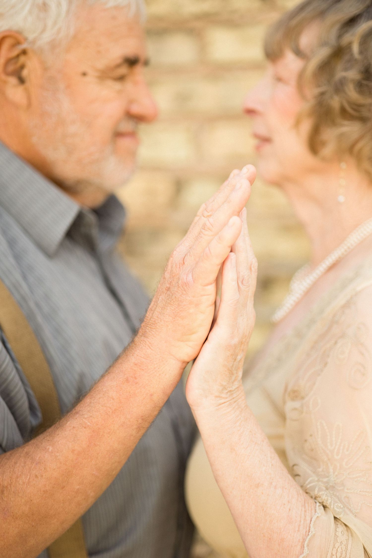older couple holding hands