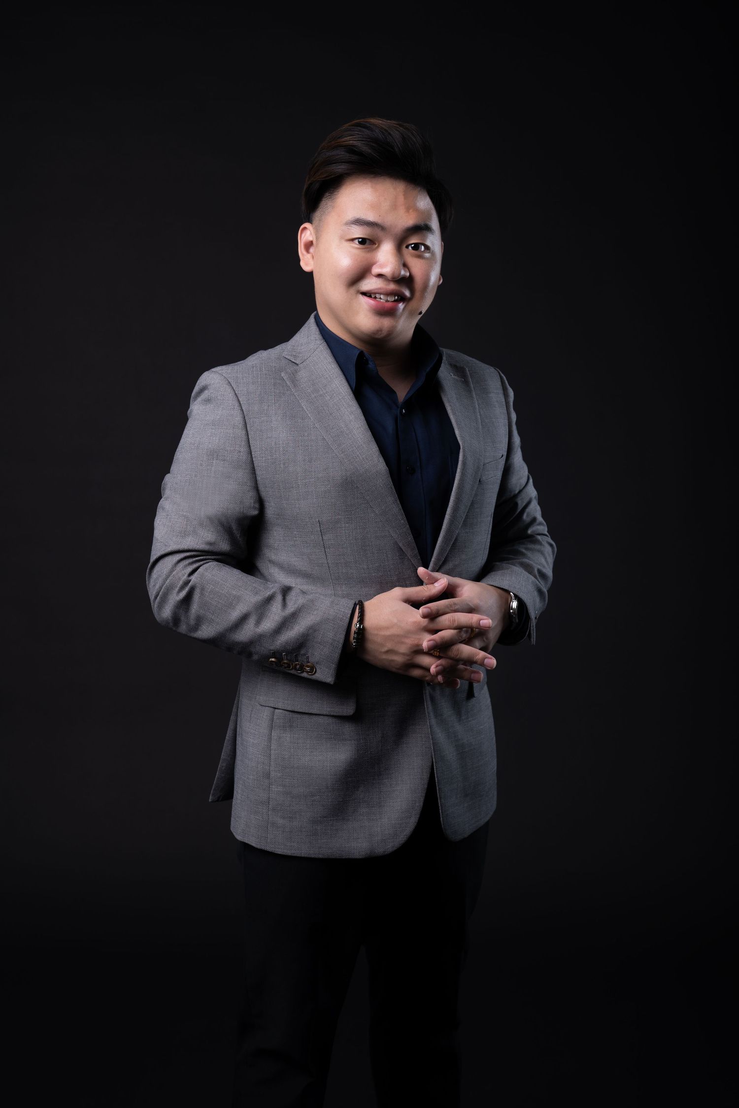 Professional Studio portrait with black background with blazer