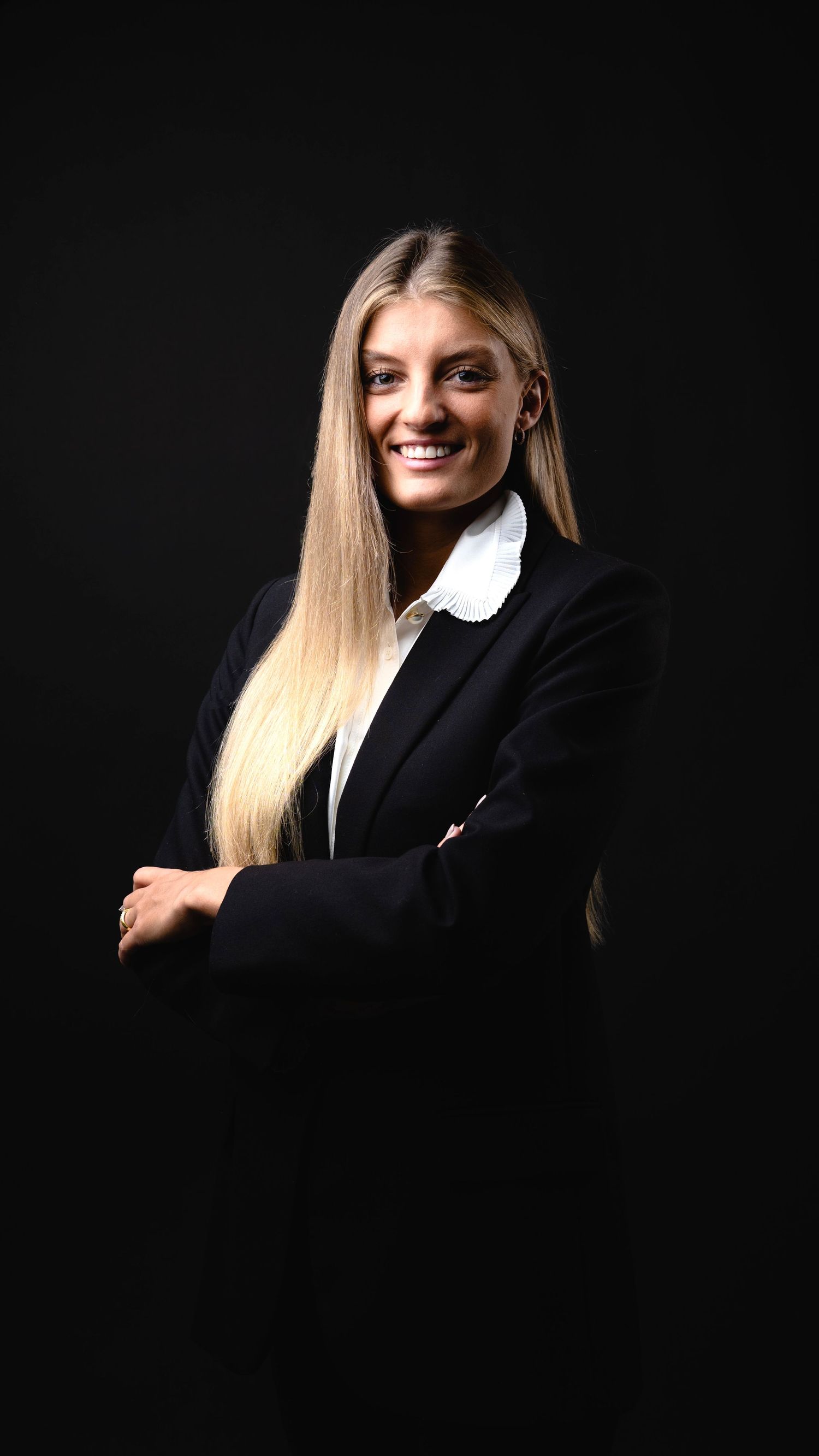 Professional studio headshot of lady with black background