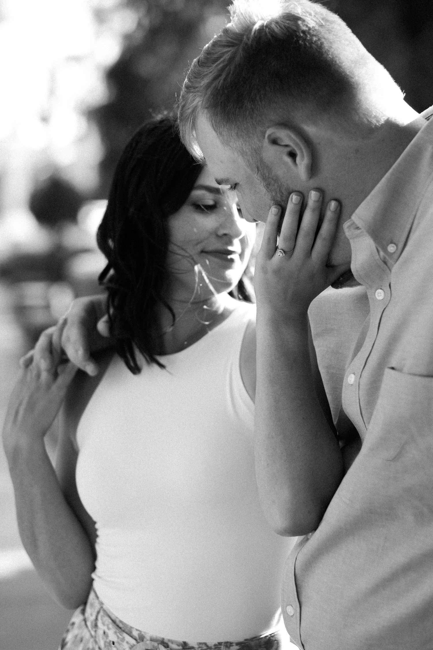 Black and white close-up photos capturing tender emotional moments between a couple.