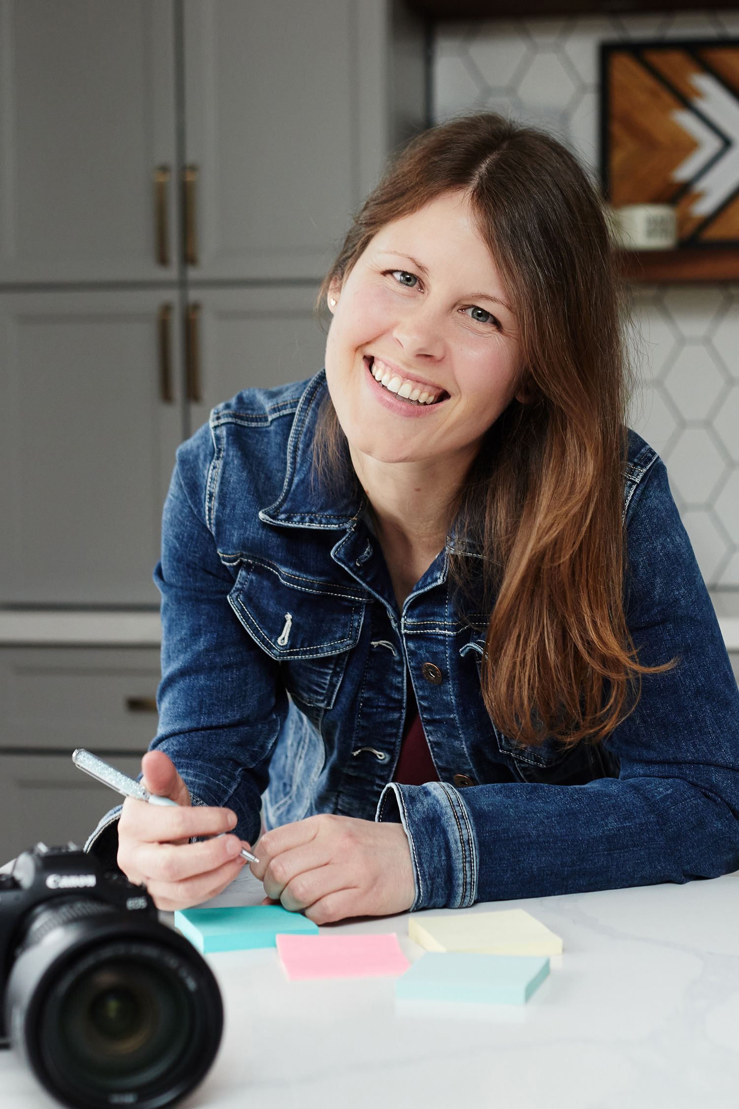 Fun female Photographer branding portrait with Canon camera and post it notes.