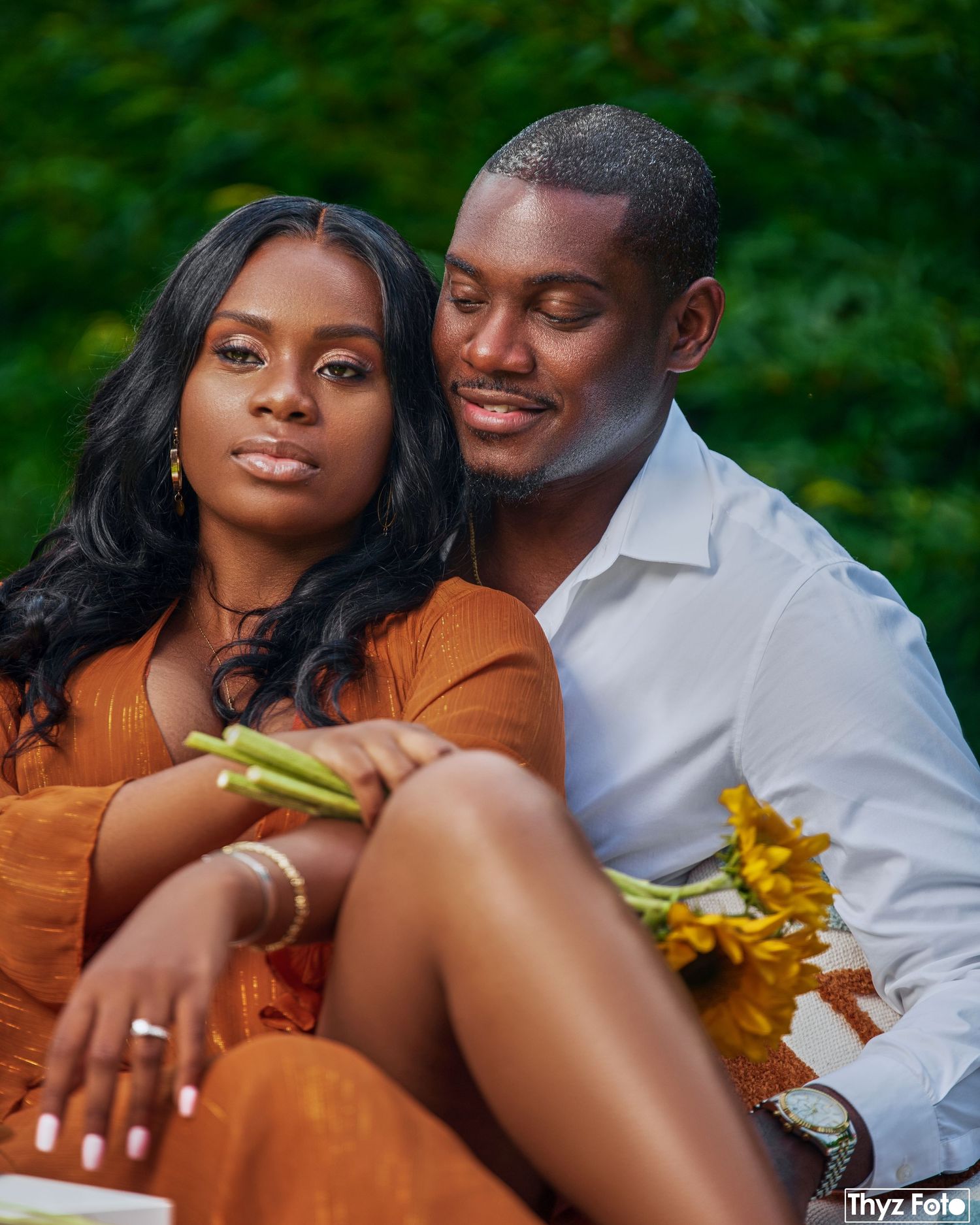 Intimate couple portrait in an outdoor setting, capturing love, connection, and elegance.