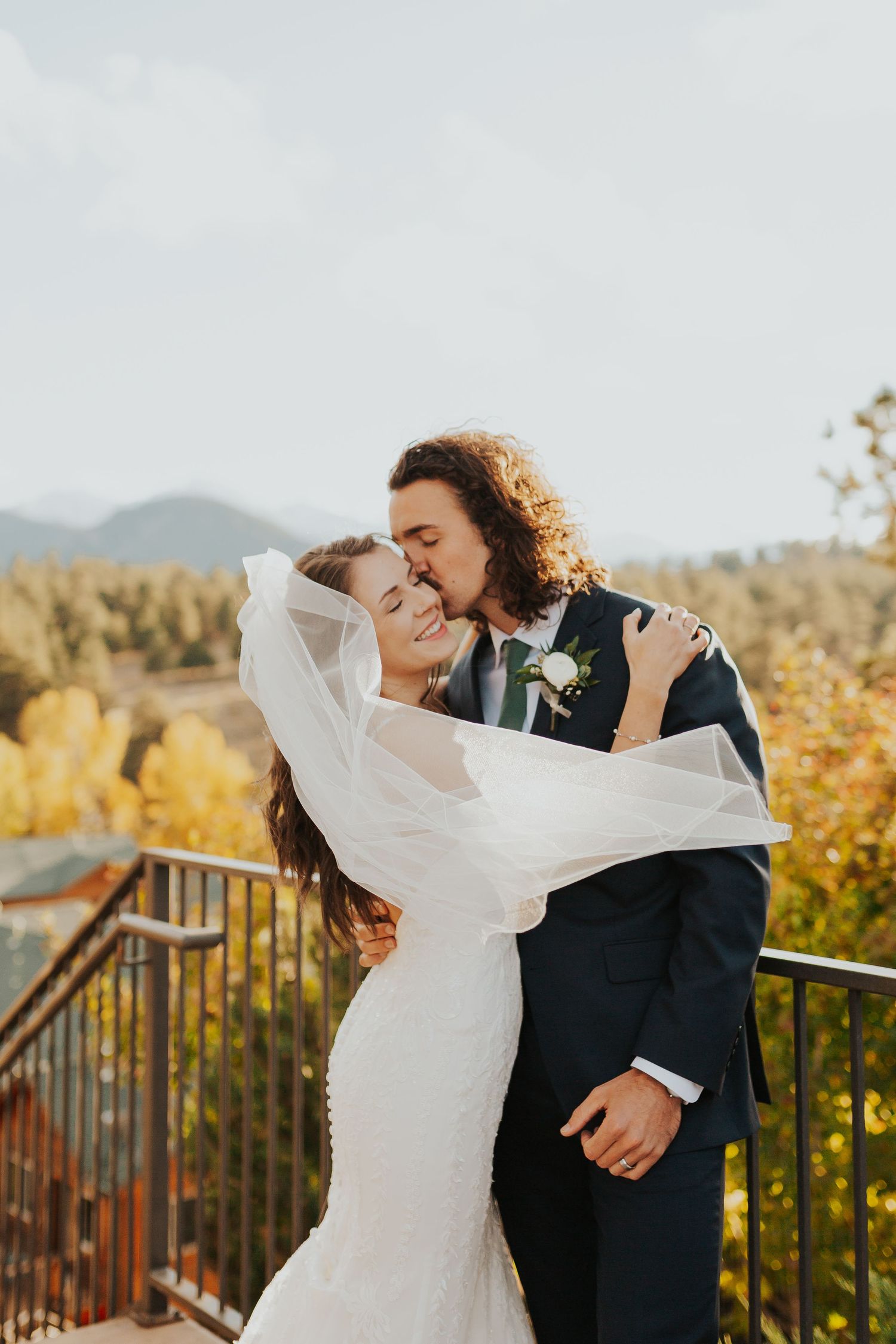 Bride and groom kissing at Estes Park, Colorado