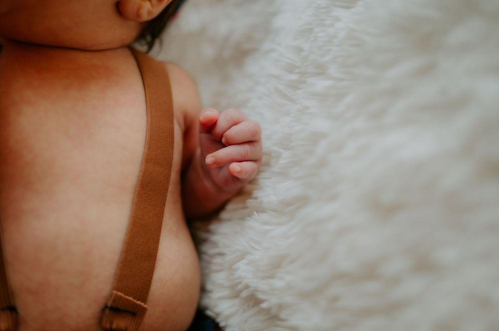 Baby's hand on a blanket