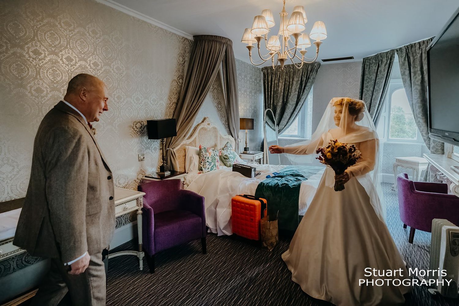 father of the bride sees his daughter in her wedding dress for the first time. north Wales wedding photographer
