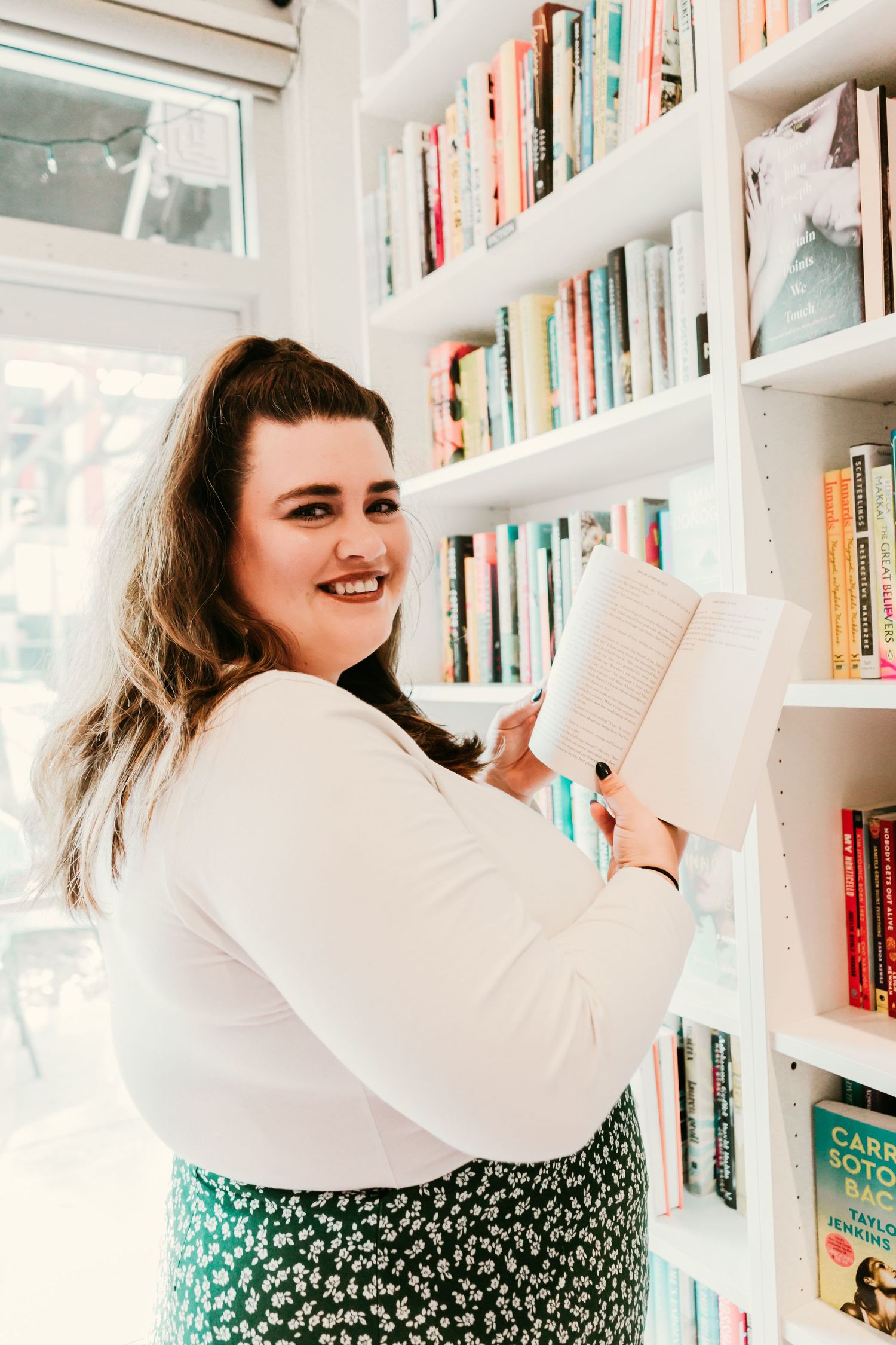 Outdoor Headshot Session in St. Pete, FL; Woman shopping for books in bookstore