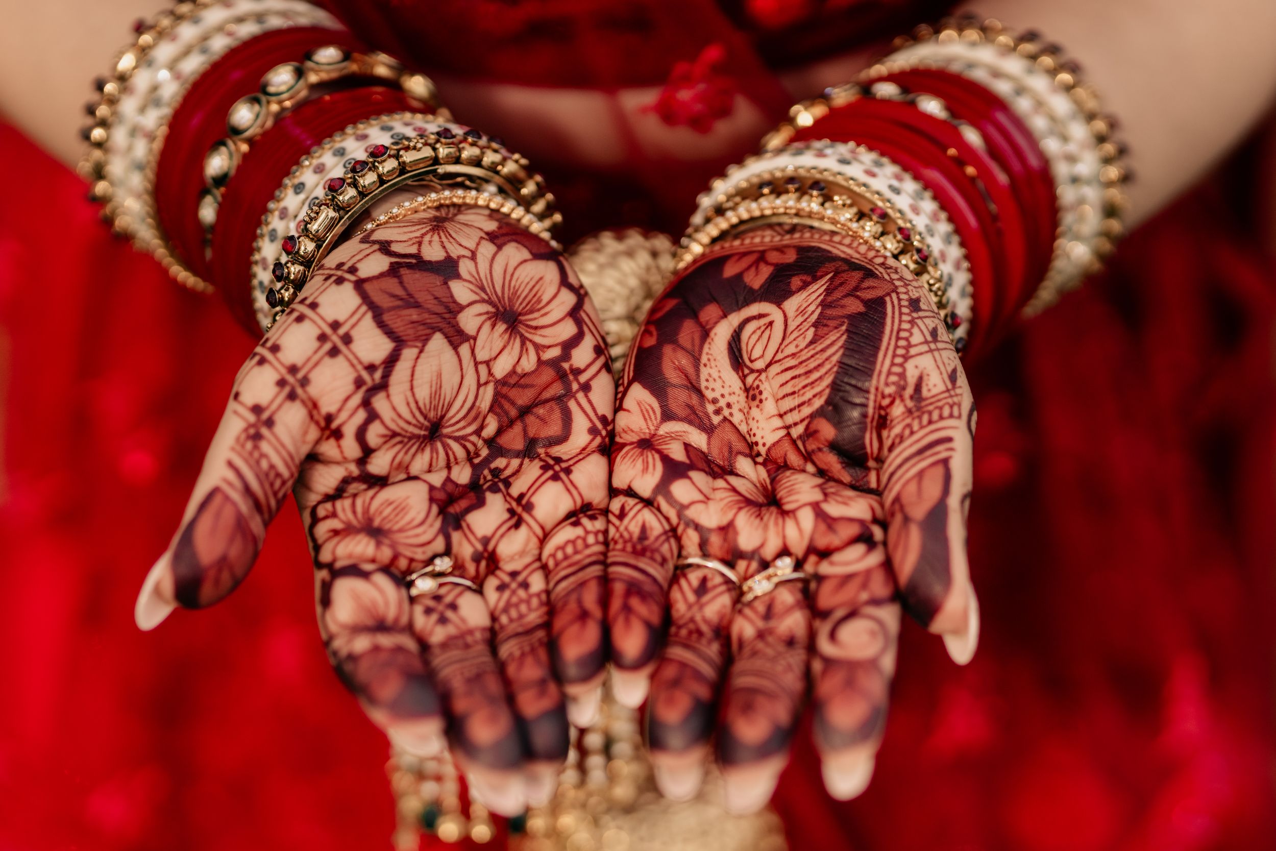 Intricate henna designs on palms displaying traditional Indian bridal mehndi art.