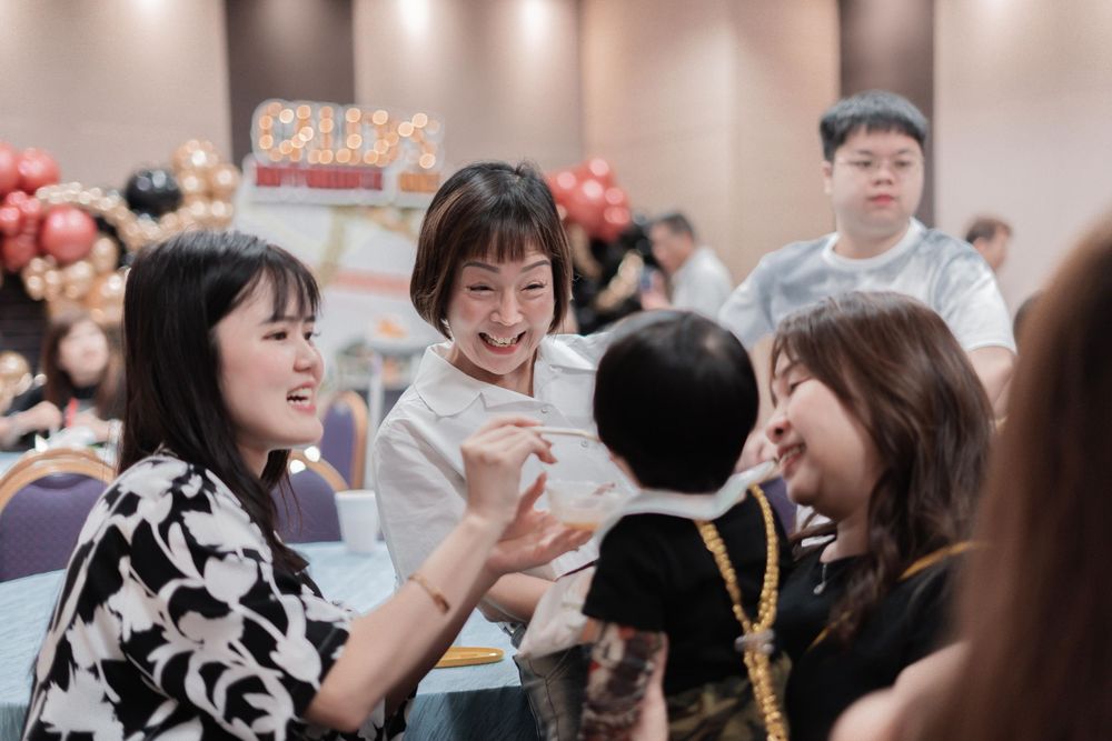 Happy celebration scene with guests enjoying a festive party atmosphere.