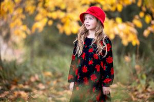 Longwood gardens fall portrait with red hat