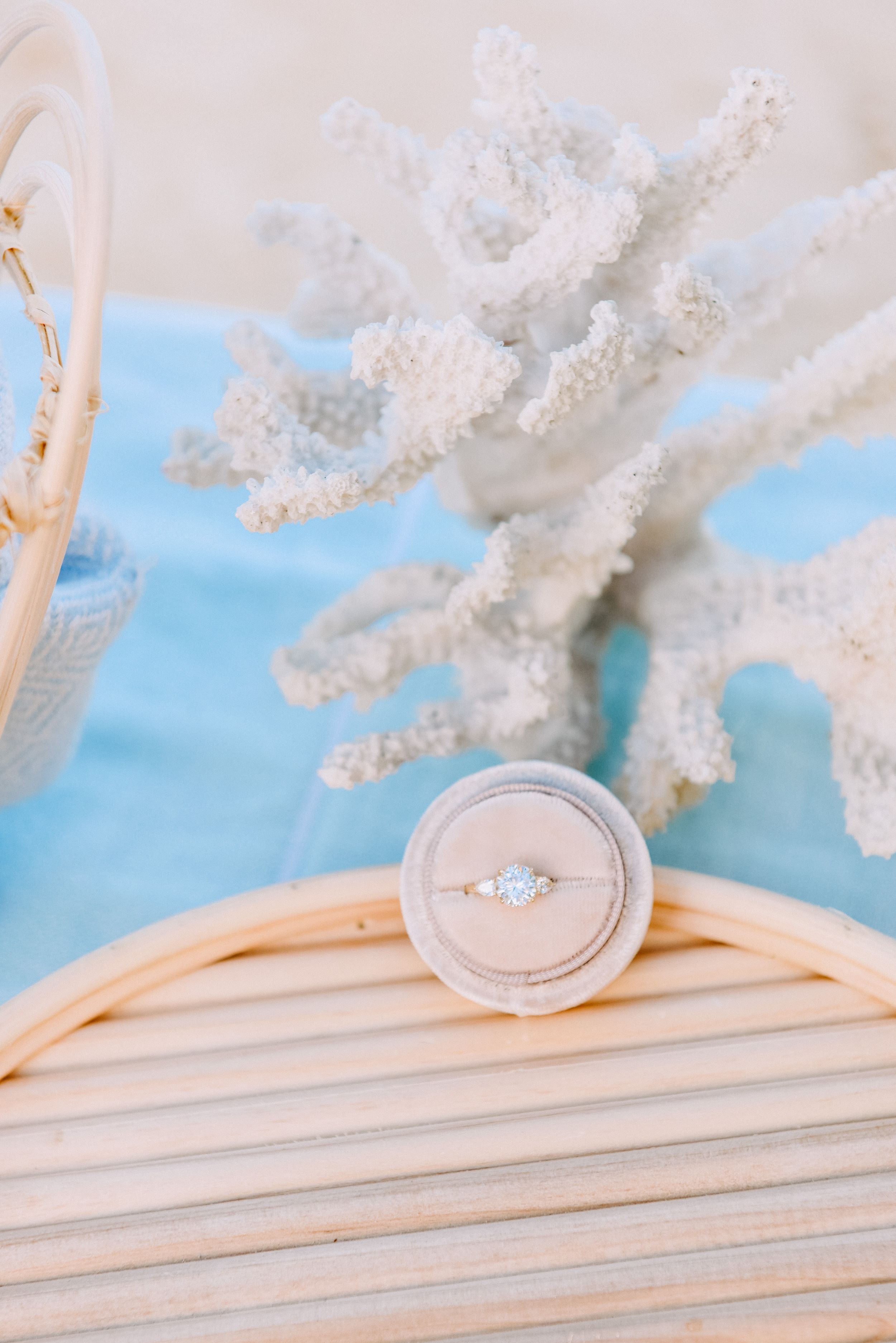 Surprise beach proposal ring details in Lanikai, Oahu.
