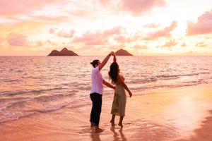 Creative couples content session during golden hour in Lanikai Hawaii.