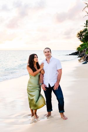 A couple enjoying a romantic evening during golden hour photos in Oahu.