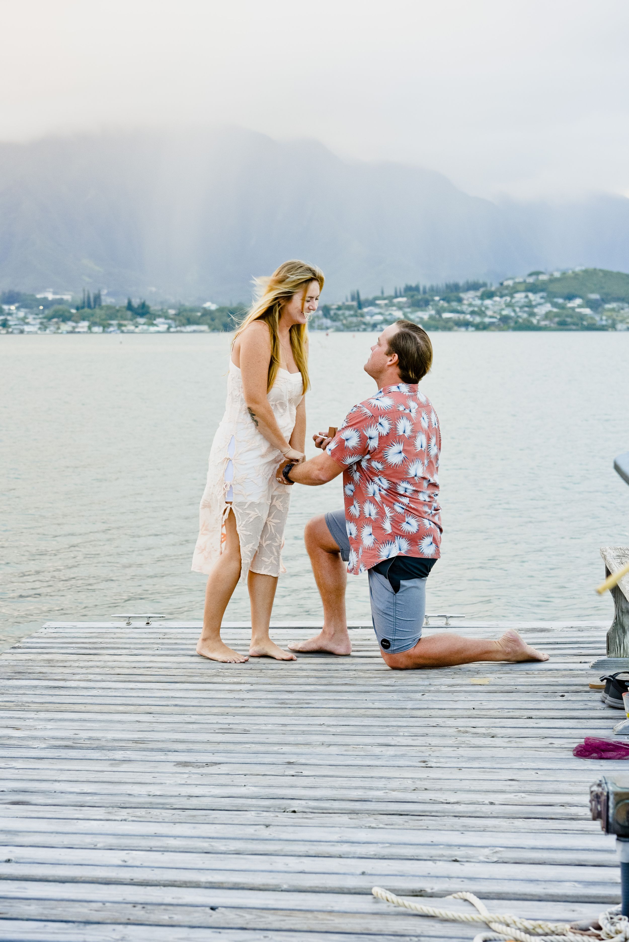 Surprise Kaneohe Yatch Club proposal with ocean backdrop in Oahu.