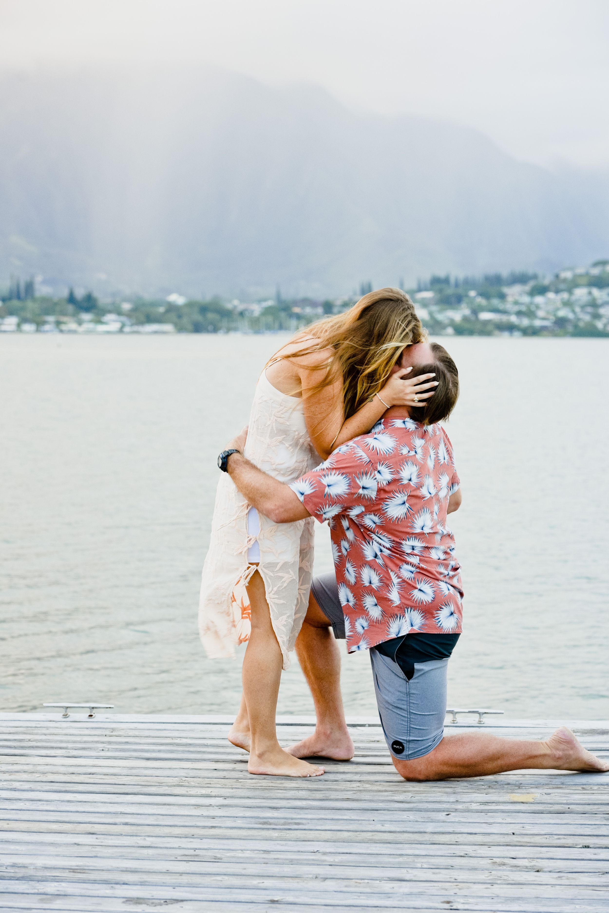 Surprise Kaneohe Yatch Club proposal with ocean backdrop in Oahu.