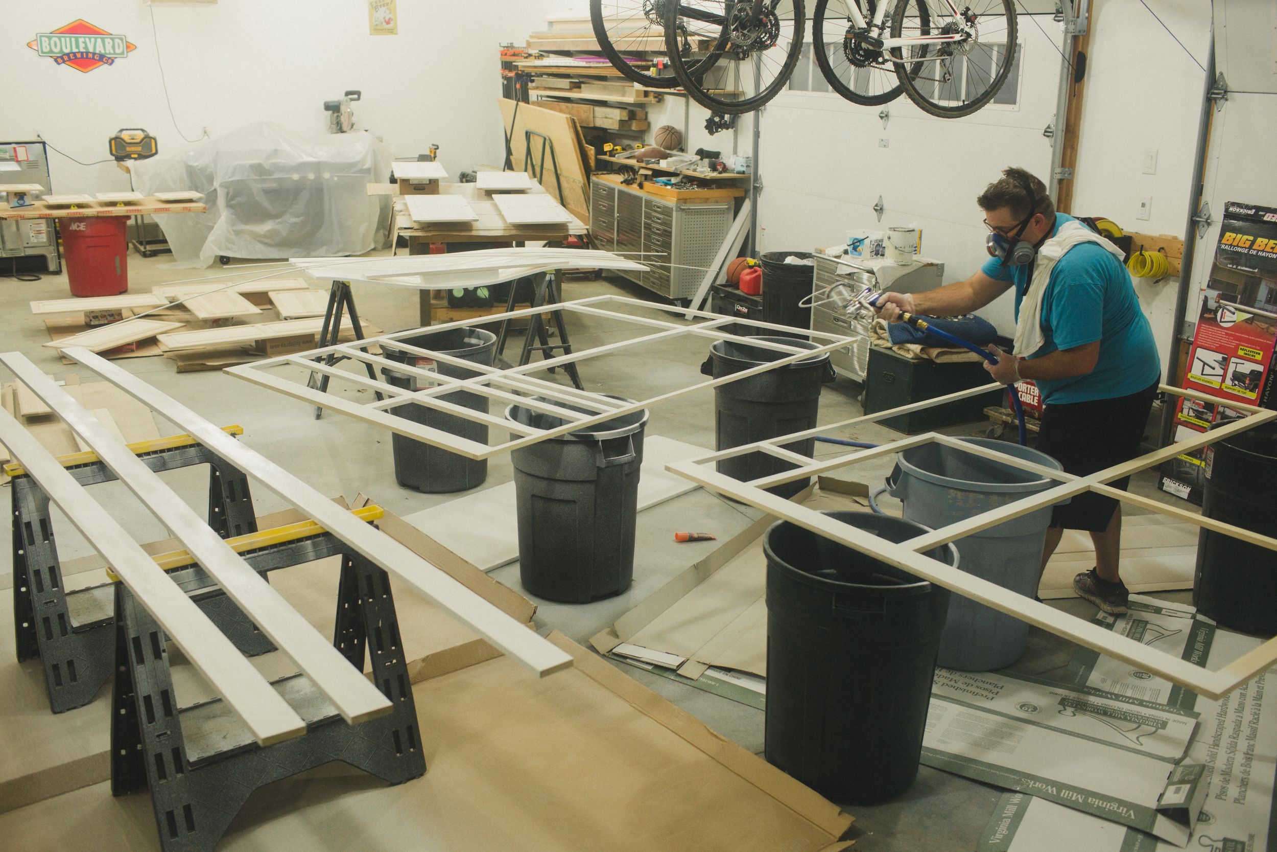 Workshop space with metal framing and construction equipment being assembled.