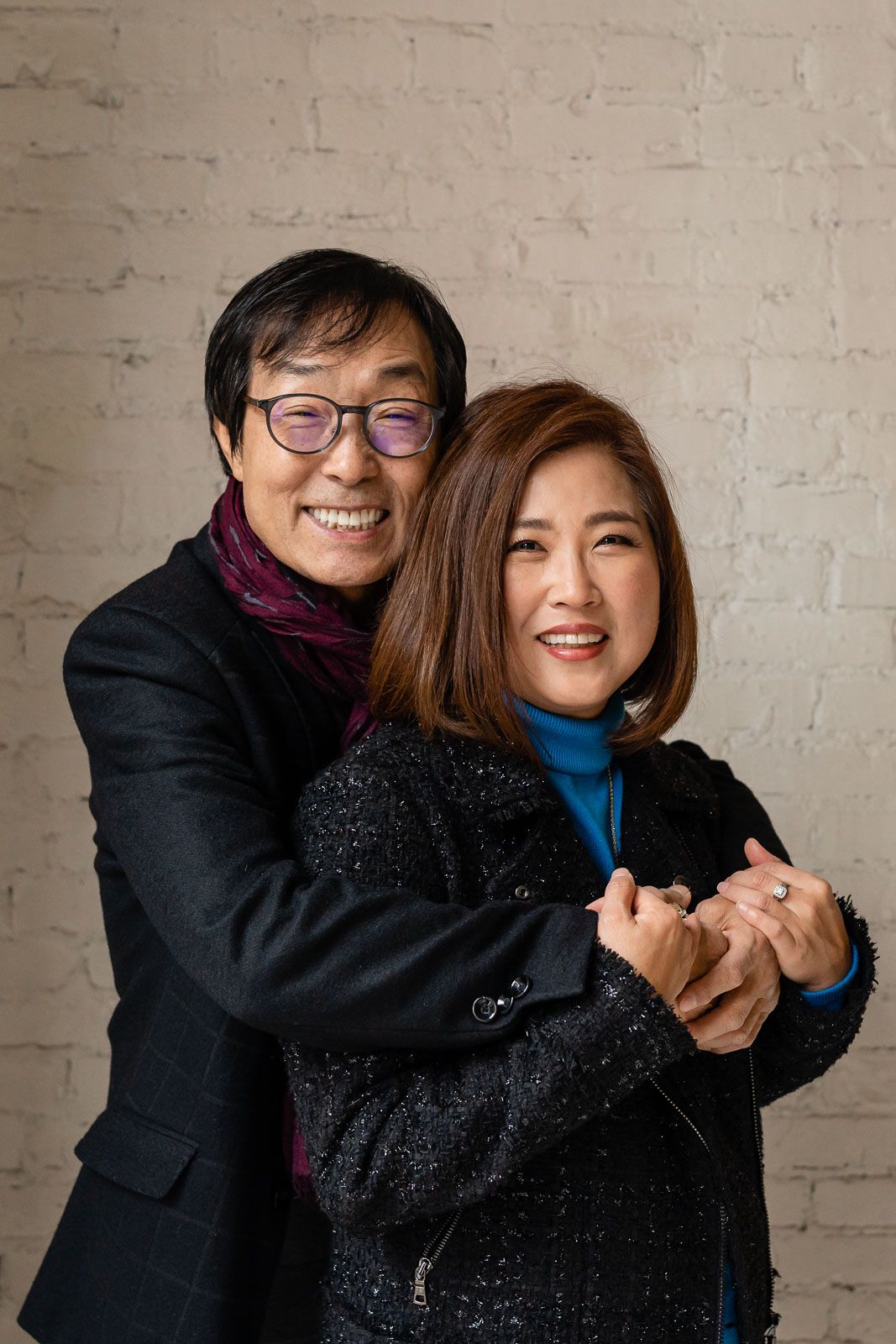 Couple smiles in an indoor studio in Pioneer Square
