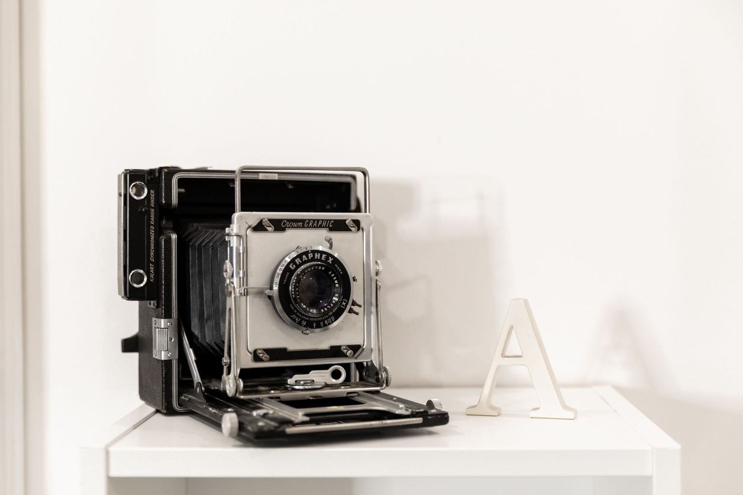 Vintage Camera and the letter "A" sitting on shelf. Beverly Hills photographer