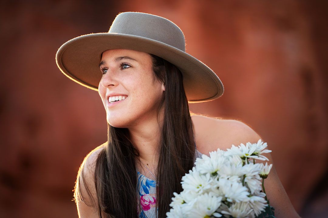 High-school-senior-girl-chuckwalla-margie-temme-photography-st-george-photographer-red-rocks-light-sunset-hat-snow-canyon-utah-destination
