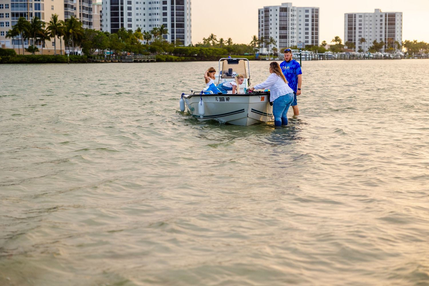 Family on a boat in bonita spring Florida