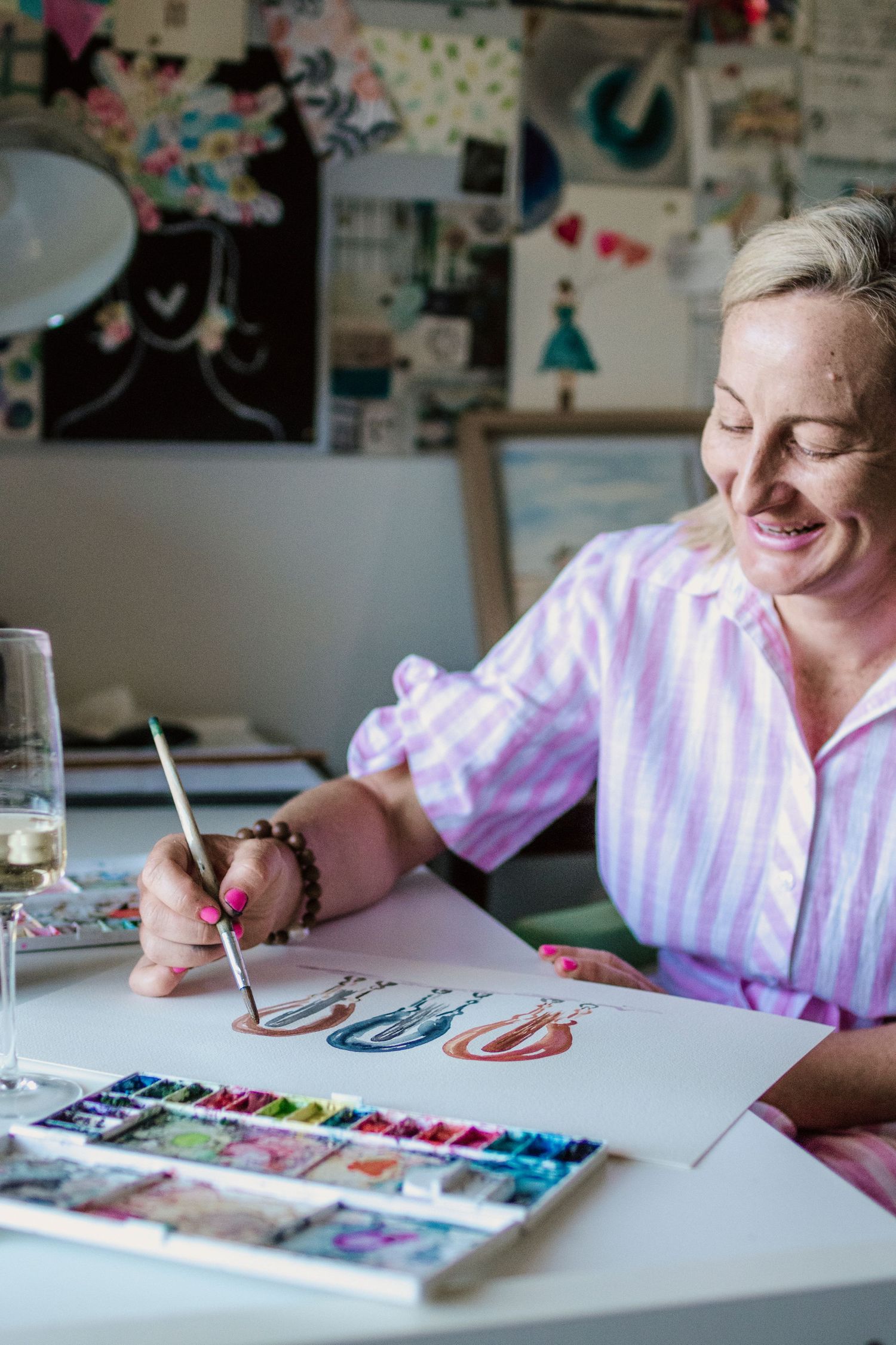 Miss Vet in her studio painting a horse artwork in watercolour