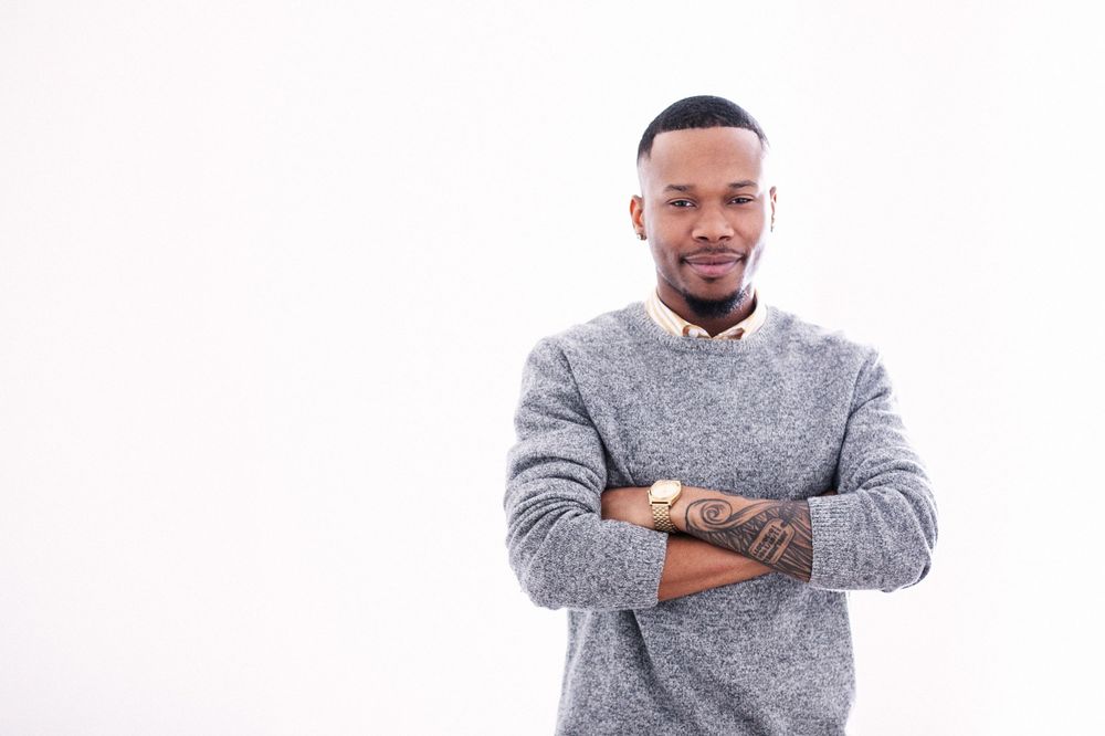 portrait of an African American interior designer on a white background