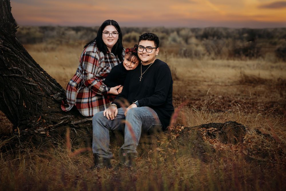 Young hispanic family portrait taken in the San Luis Valley of Southern Colorado.