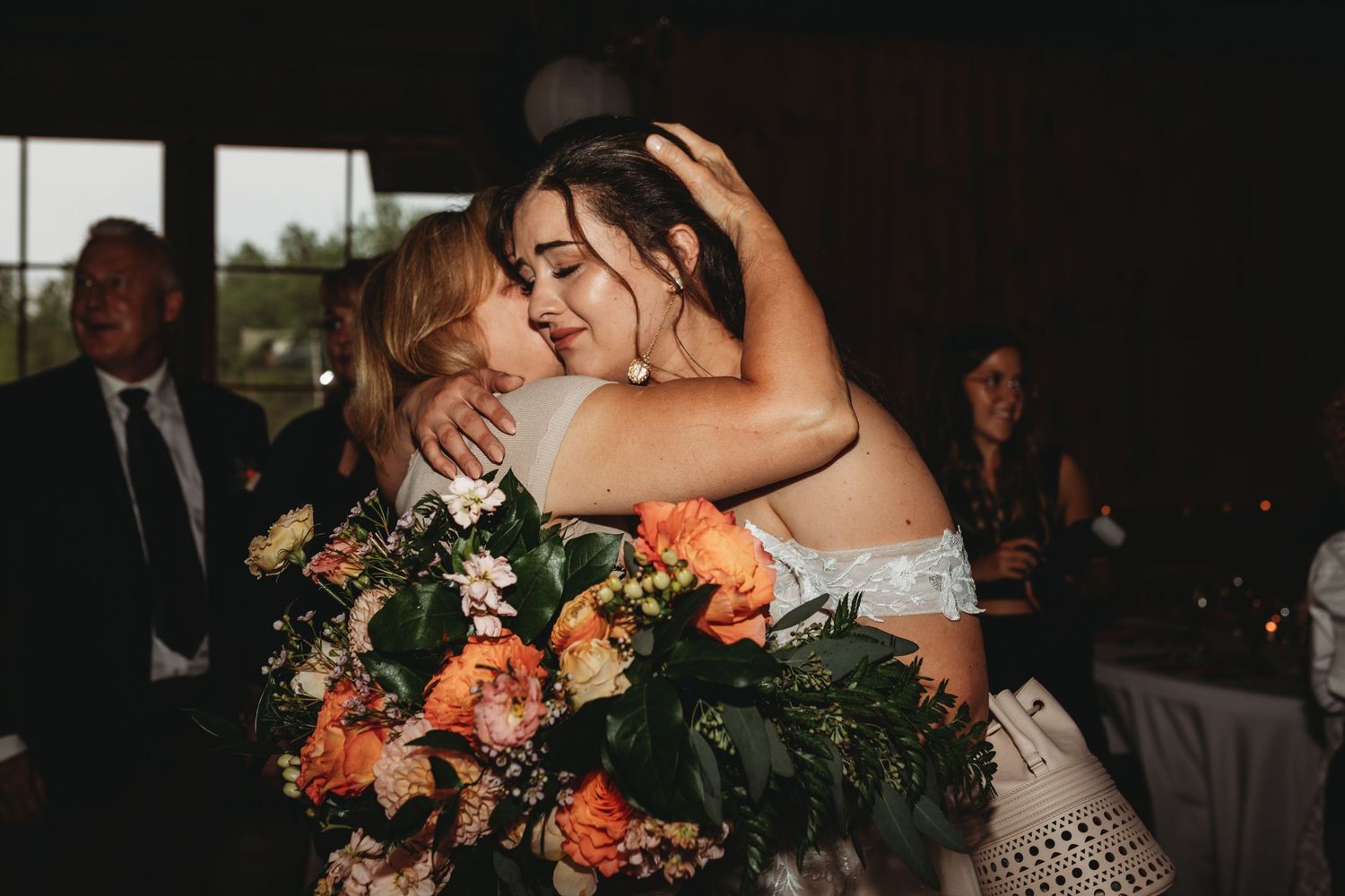 emotional moment between bride and mother after ceremony mont tremblant