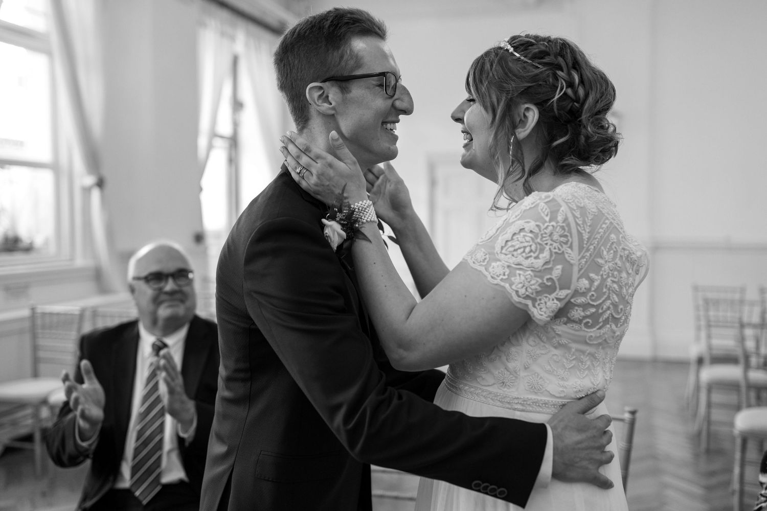 Alice and Josh at Brighton Registry office about to share their first kiss together