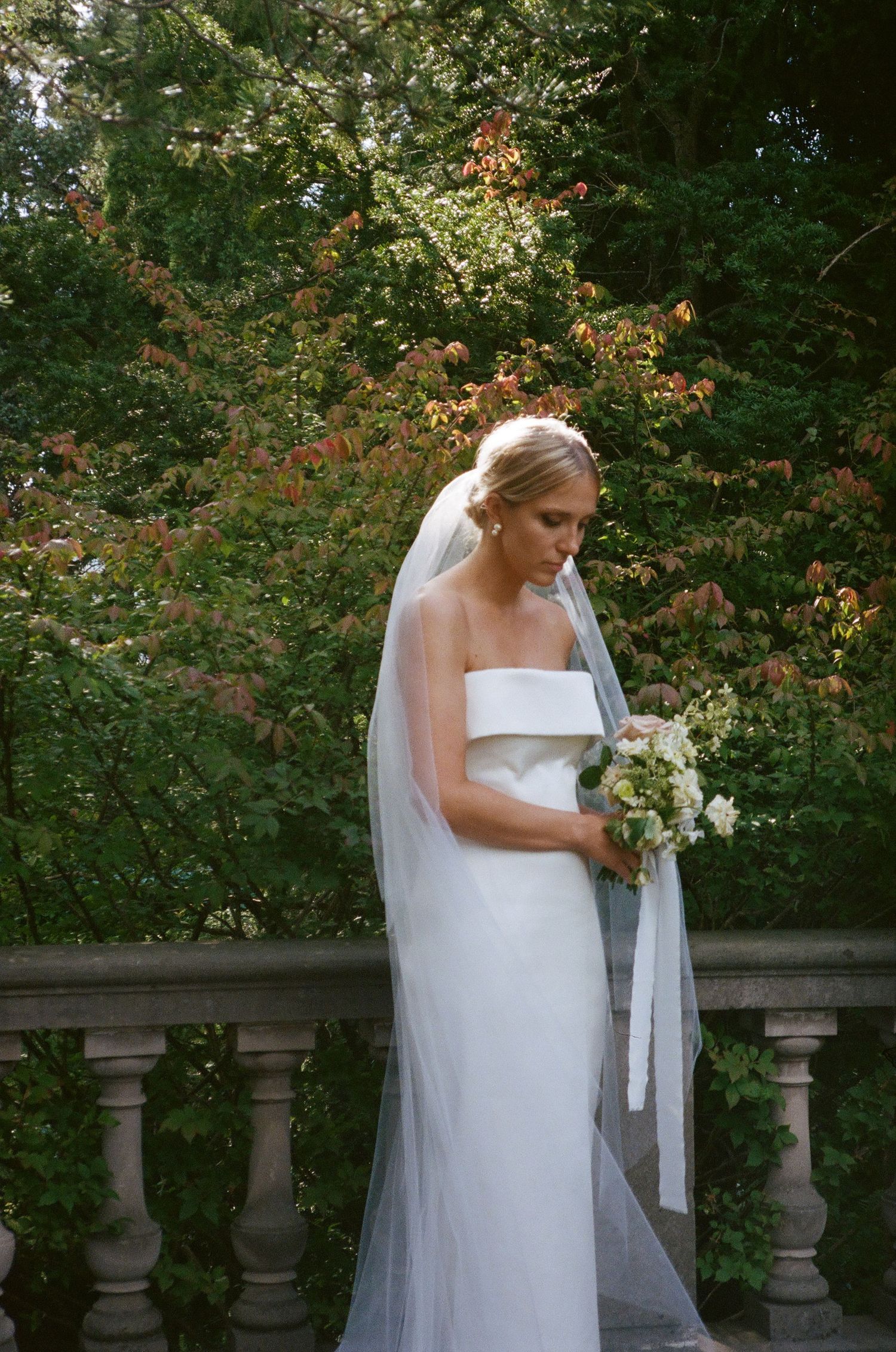 Portrait of bride holding her bouquet at Graydon Hall Manor wedding venue | Toronto wedding photographer