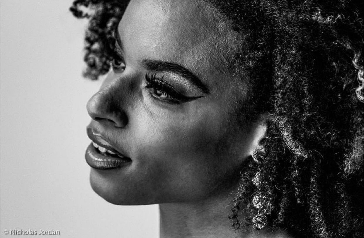 Black and white profile portraits showing different expressions and natural curly hair.
