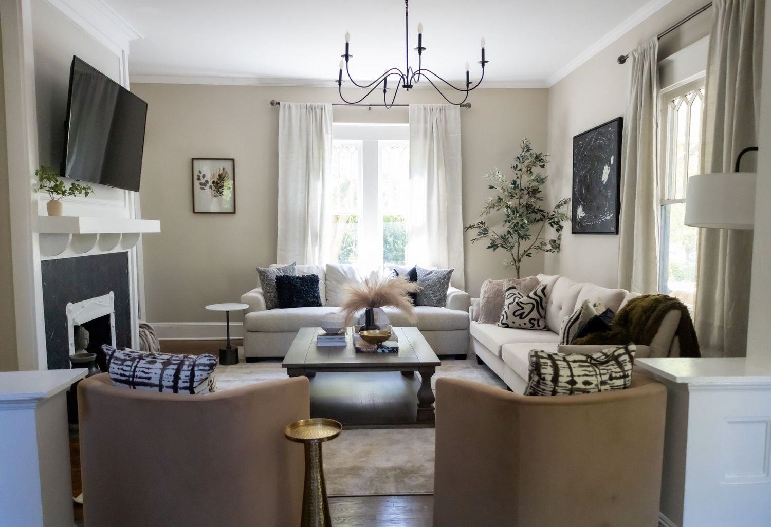Sophisticated living room featuring a harmonious blend of modern furniture, tasteful decor, and a refined color scheme.