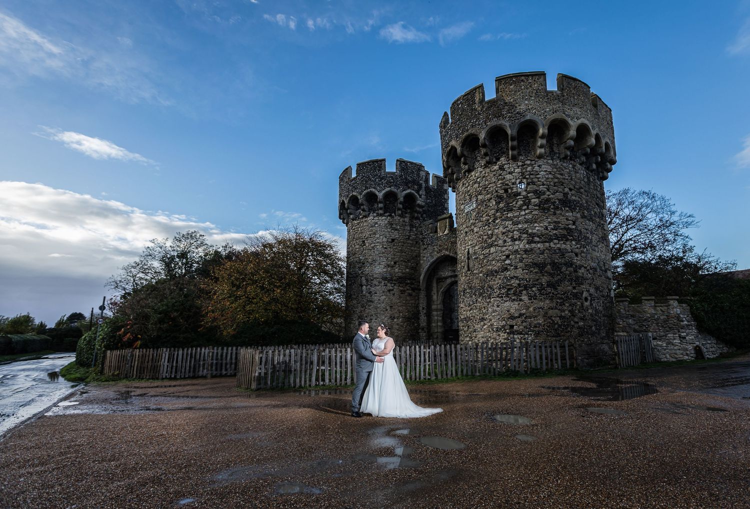 Bride and Groom posing for Wedding Photography outside Cooling Castle Barn in Kent