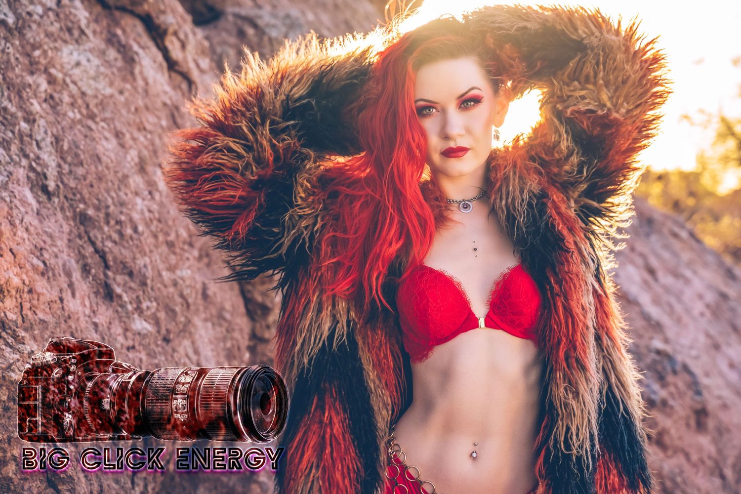 Sexy female model in a faux fur coat and lingerie, posing in the Arizona desert with styled hair and makeup.