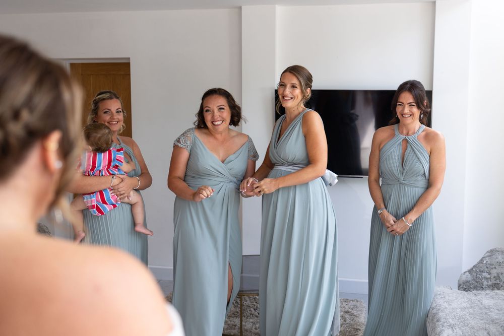 Bride with bridesmaids first look