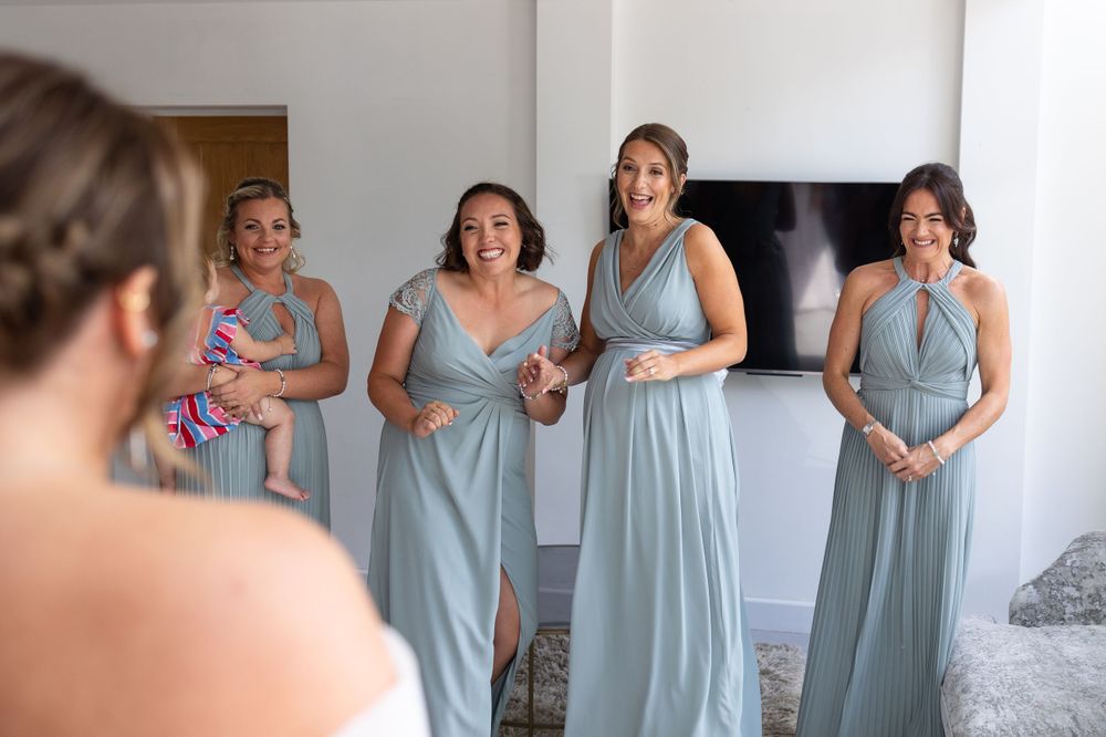 Bride with bridesmaids first look