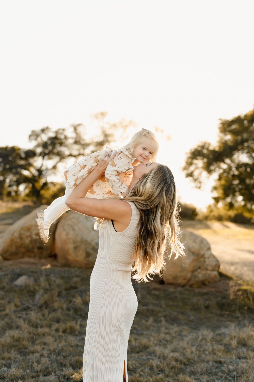 mommy & me photoshoot by Ventura and Thousand Oaks photographer of mom in grassy field with toddler girl
