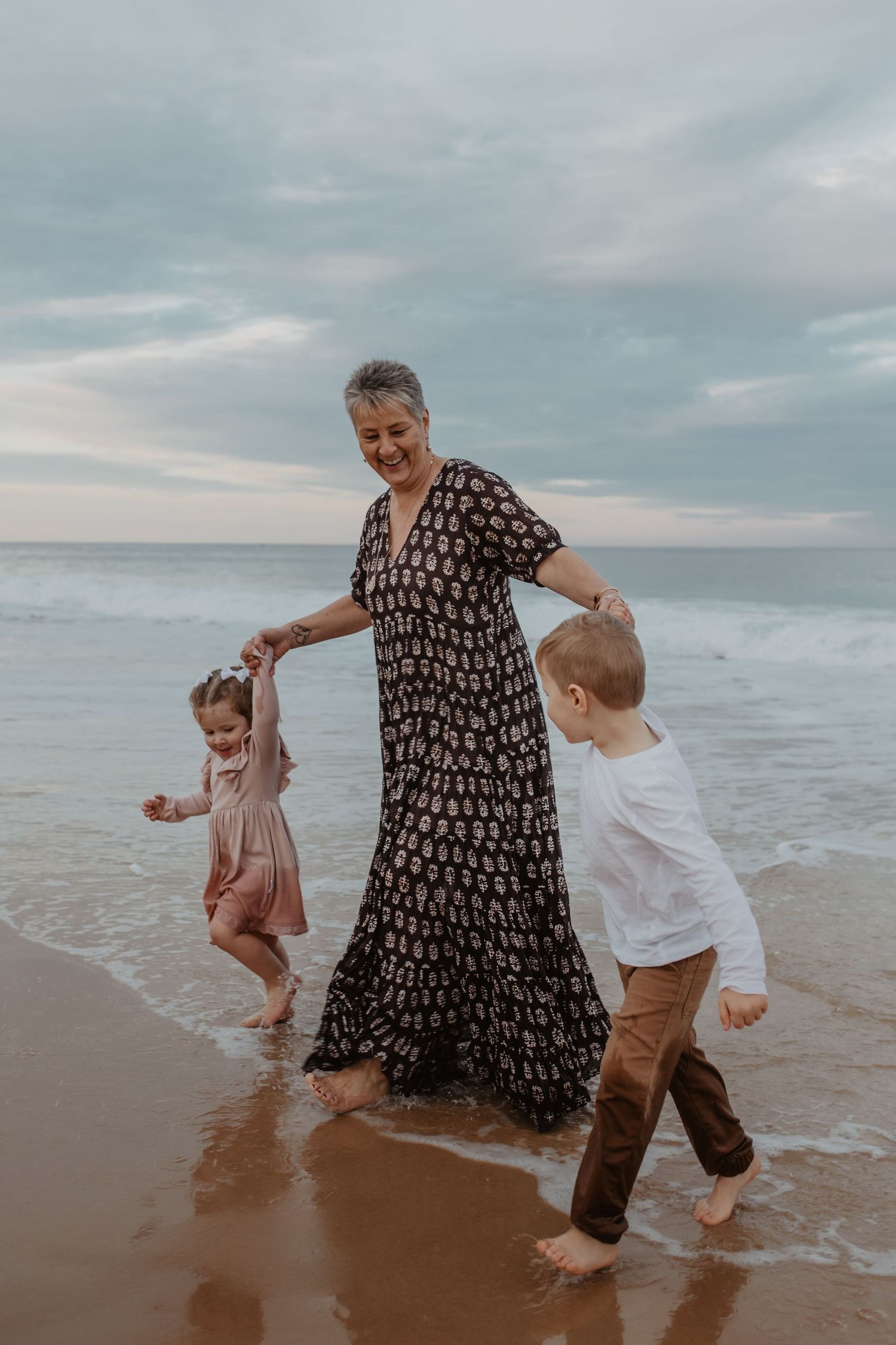 Grandmother with Grandchildren on the beach. Newcastle Family Photography