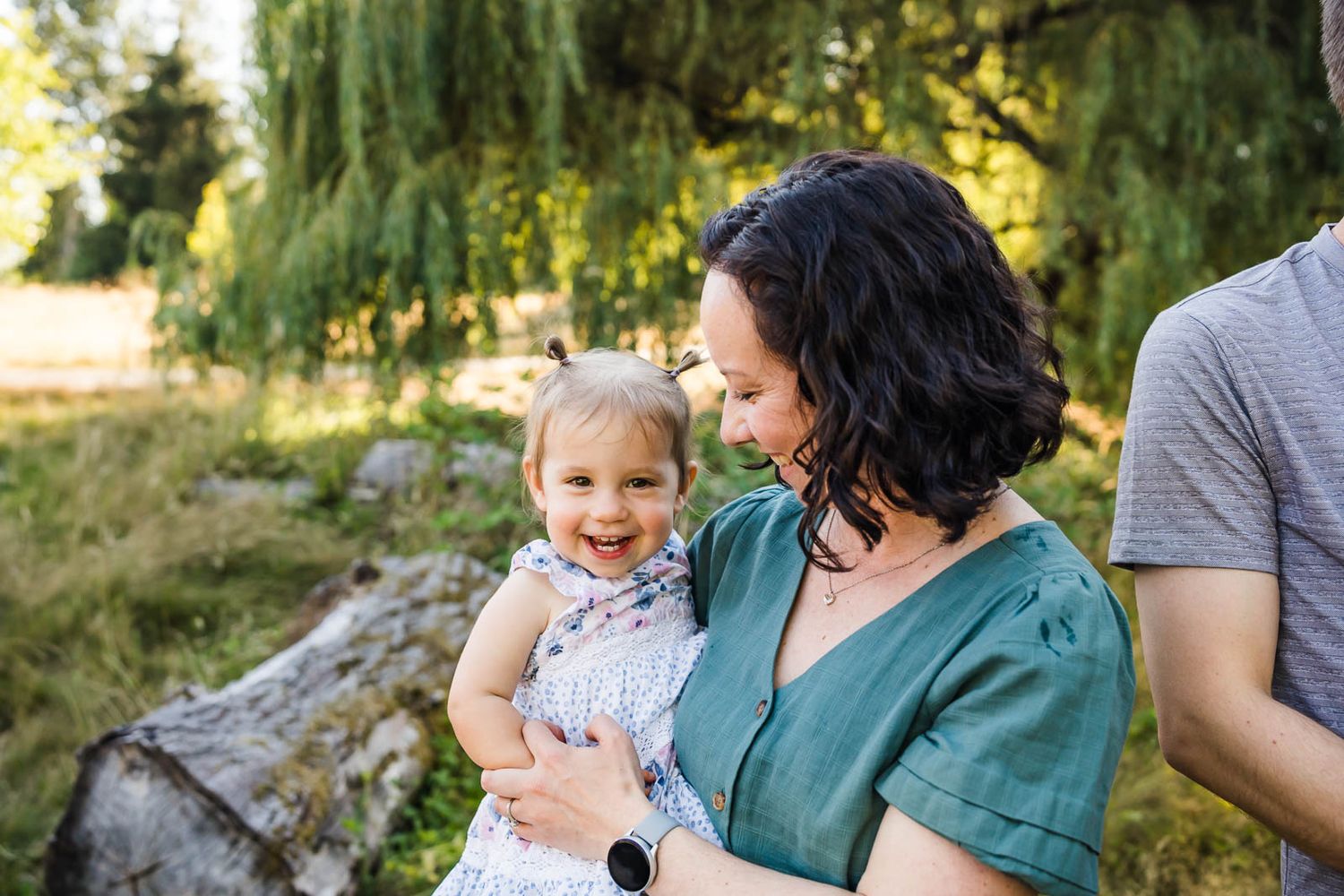 Mother snuggling with her happy daughter in Kirkland.