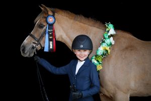 black background images of young equestrian competitor and her pony