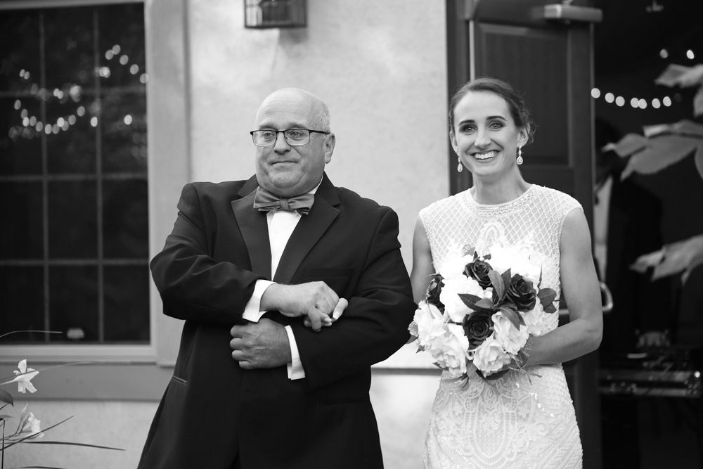 Bride is walked down the aisle by father at her wedding in Delaware Ohio.