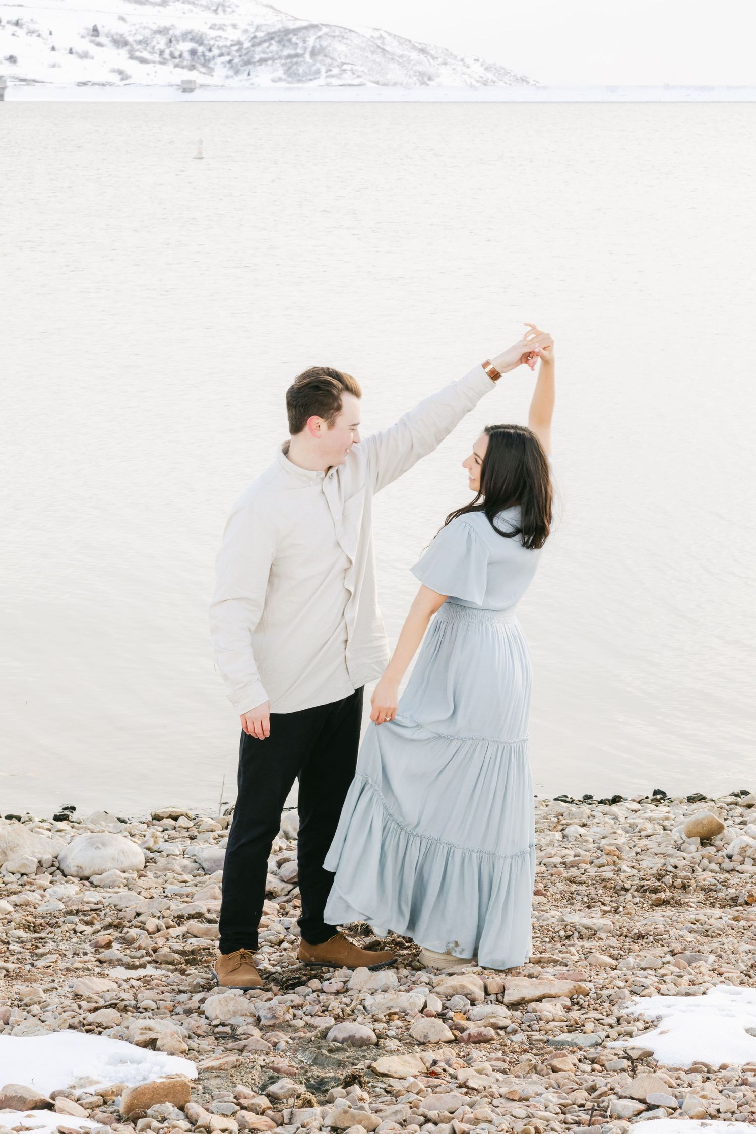 Dancing fun engagement session in a wintery beach session
captured by Chelsee Rawe Photography