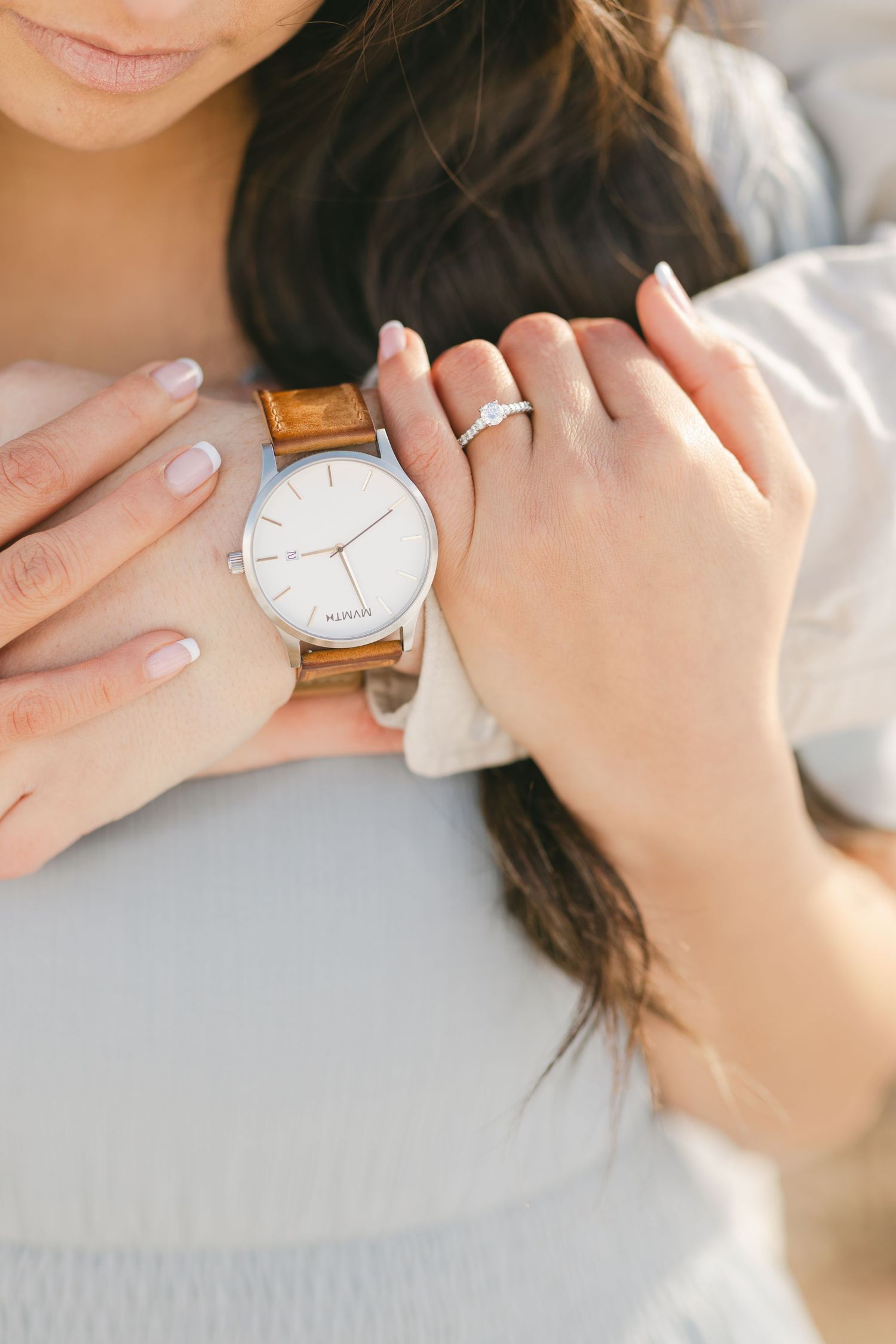 Picture of a groom's watch and a bride's wedding ring
captured by Chelsee Rawe Photography