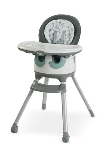 Modern gray and white high chair with padded seat and adjustable tray.