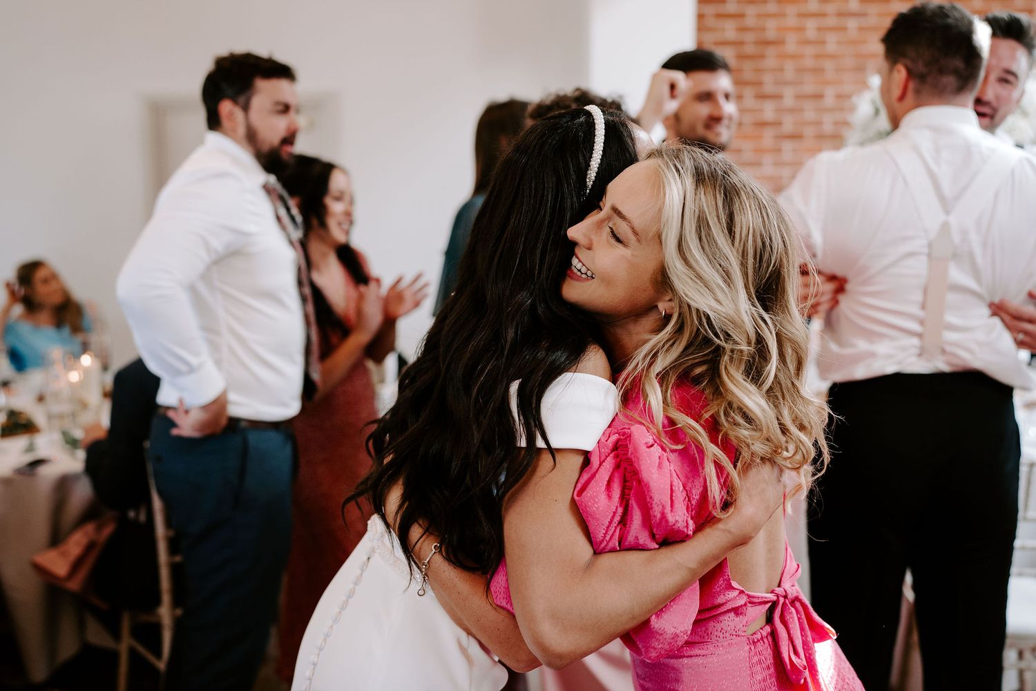 bride-hugging-guest-stockton-house-wedding-shropshire