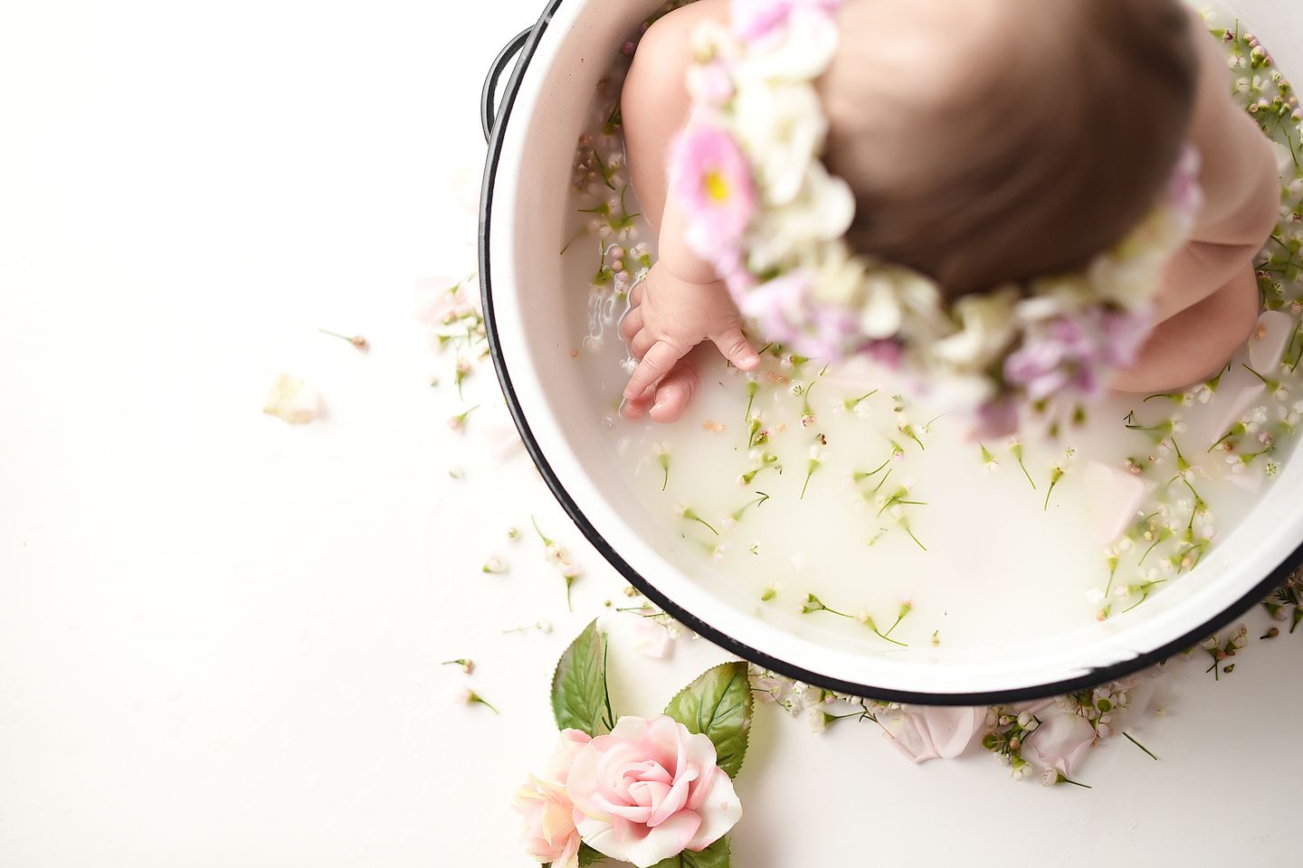 Tiny toes in a milkbath with flowers