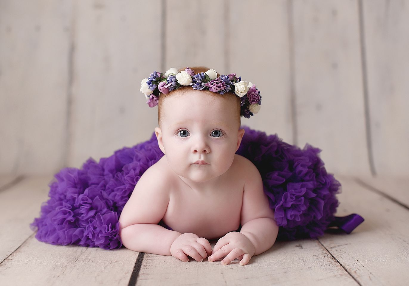 Baby posed for a photograph with a tutu