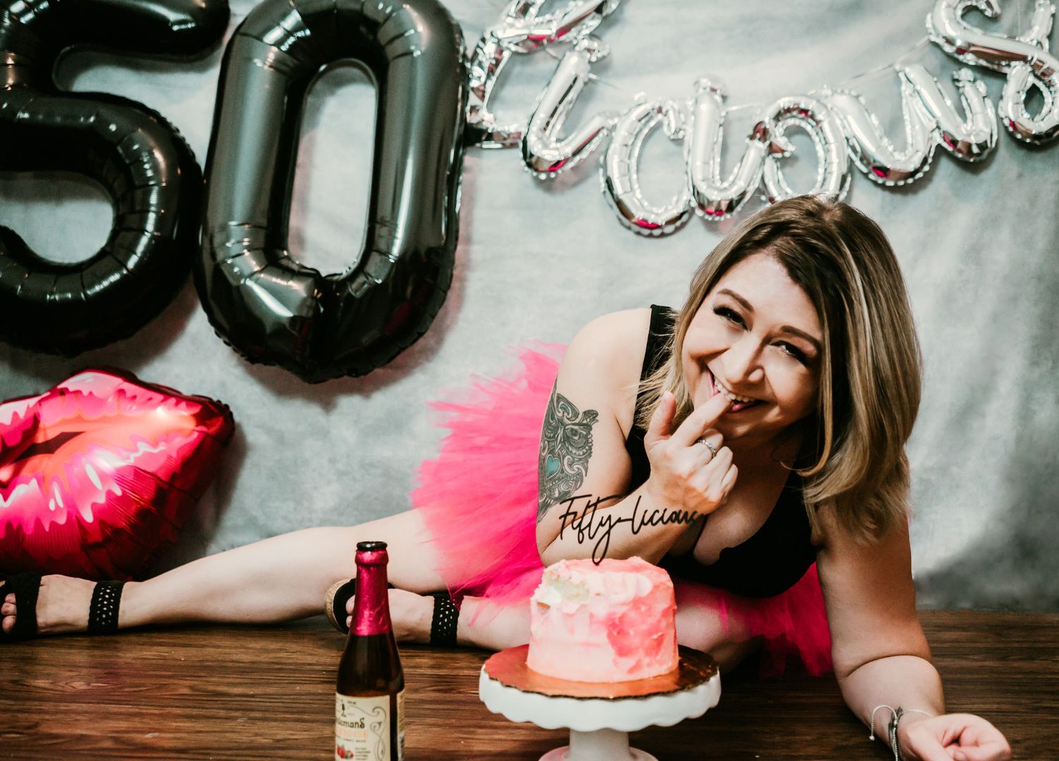 Studio Cake Smash Session in Home Ruskin, FL; Woman laying down eating cake