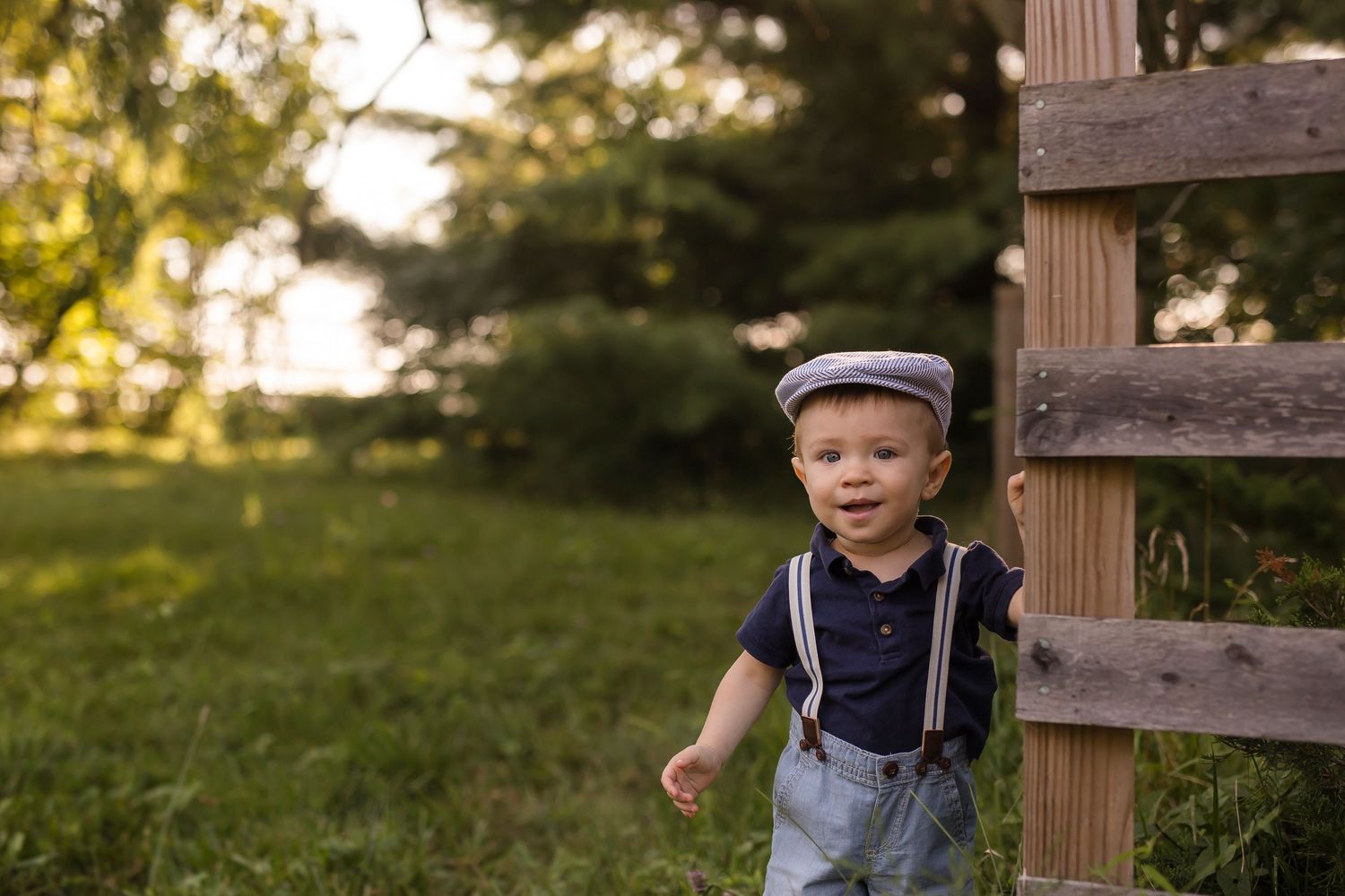 Playful children's portrait series near wooden fence in natural lighting.